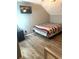 Comfortable bedroom featuring modern flooring, a cozy bed, and neutral decor at 7906 Waterview Way # 7906, Winter Haven, FL 33884