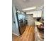 Modern kitchen featuring white cabinets, stainless steel appliances, and granite countertops at 7906 Waterview Way # 7906, Winter Haven, FL 33884