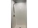 Bright white tiled shower with modern shower head and fixtures at 7906 Waterview Way # 7906, Winter Haven, FL 33884