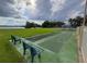 Community shuffleboard court, green grass, and a view of the water at 7906 Waterview Way # 7906, Winter Haven, FL 33884
