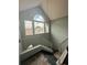 Stairway features large windows and a modern chandelier at 7906 Waterview Way # 7906, Winter Haven, FL 33884