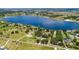 Aerial view of the property surrounded by a large lake at 836 S Lake Starr Blvd, Lake Wales, FL 33898