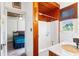 Compact bathroom with wood-trimmed shower and tub, next to a bedroom at 836 S Lake Starr Blvd, Lake Wales, FL 33898