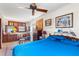 Bedroom featuring a full bed, wood furniture, and natural light, with art on the walls at 836 S Lake Starr Blvd, Lake Wales, FL 33898