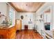 Bedroom featuring hardwood floors, wood ceilings, and windows overlooking the yard at 836 S Lake Starr Blvd, Lake Wales, FL 33898