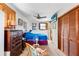 Cozy bedroom features closet, ceiling fan, tv and bright natural light at 836 S Lake Starr Blvd, Lake Wales, FL 33898