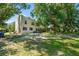 Charming older home with stucco exterior, mature trees and a spacious yard at 836 S Lake Starr Blvd, Lake Wales, FL 33898