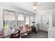 Enclosed porch with laundry and table at 836 S Lake Starr Blvd, Lake Wales, FL 33898