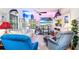 Eclectic living room with comfortable seating, unique decor, and plenty of natural light, perfect for entertaining at 836 S Lake Starr Blvd, Lake Wales, FL 33898