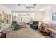 Spacious living room with sofas, recliner and natural light streaming through the windows at 836 S Lake Starr Blvd, Lake Wales, FL 33898
