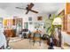 Cozy living area offering a unique decor with chairs, houseplants and access to the kitchen at 836 S Lake Starr Blvd, Lake Wales, FL 33898