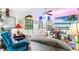 Bright living room with comfortable seating, unique decor, and plenty of natural light, creating a cozy atmosphere at 836 S Lake Starr Blvd, Lake Wales, FL 33898