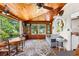 Comfortable living area with wood ceiling, natural light, and a view of the yard at 836 S Lake Starr Blvd, Lake Wales, FL 33898