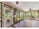 Spacious sunroom with brick flooring and large windows to enjoy outdoor views at 836 S Lake Starr Blvd, Lake Wales, FL 33898