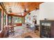 Inviting sunroom featuring wood paneling, lots of windows and a comfortable seating area perfect for relaxation and enjoying the view at 836 S Lake Starr Blvd, Lake Wales, FL 33898