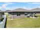 The home's outdoor patio boasts ample seating and lush green space, perfect for relaxation and entertainment at 8720 Micmac Ct, Polk City, FL 33868