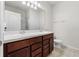 Bathroom featuring double sinks and walk-in shower at 8720 Micmac Ct, Polk City, FL 33868