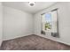 Bedroom with a neutral color scheme and a window with blinds and curtains at 8720 Micmac Ct, Polk City, FL 33868