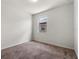 Bright bedroom features neutral carpet, trim and paint with a single window providing natural light at 8720 Micmac Ct, Polk City, FL 33868