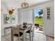 Dining room with sliding glass doors to backyard and outdoor seating at 8720 Micmac Ct, Polk City, FL 33868