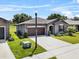Charming single-Gathering home featuring a well-maintained lawn, neutral exterior, and a two-car garage at 8720 Micmac Ct, Polk City, FL 33868
