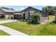 Manicured lawn and tasteful landscaping highlight the exterior of this lovely single-Gathering home at 8720 Micmac Ct, Polk City, FL 33868