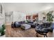 Bright, open-concept living space with hardwood floors connecting to the kitchen at 8720 Micmac Ct, Polk City, FL 33868