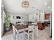 Open floor plan showcasing a living room, dining area, and kitchen with modern lighting fixtures at 8720 Micmac Ct, Polk City, FL 33868
