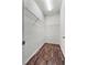 Spacious walk-in closet with wire shelving at 8720 Micmac Ct, Polk City, FL 33868