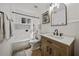 Bright bathroom with updated vanity, stylish mirror and tub with shower combination at 914 Mangham Rd, Babson Park, FL 33827