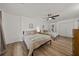 Inviting bedroom featuring two beds, wood floors, and ample space for a relaxing retreat at 914 Mangham Rd, Babson Park, FL 33827