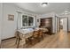 Traditional dining room featuring a floral tablecloth and a vintage wooden hutch for elegant storage and display at 914 Mangham Rd, Babson Park, FL 33827