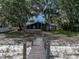 Charming waterfront home with mature trees, dock and screened porch with lake access at 914 Mangham Rd, Babson Park, FL 33827