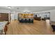 Bright, open floor plan features a living room and kitchen, and hardwood floors at 914 Mangham Rd, Babson Park, FL 33827