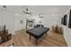 Bright living room with pool table, dining area, and comfortable seating at 914 Mangham Rd, Babson Park, FL 33827