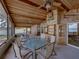 Charming covered patio with wood details, and outdoor seating area at 914 Mangham Rd, Babson Park, FL 33827