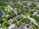 Aerial view of the house with a yellow border. Great neighborhood and surrounded by greenery at 103 Se Tuscawilla Ave, Ocala, FL 34471