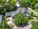 Beautiful aerial view showcases the home's roof, landscaping, and the charming neighborhood surroundings at 103 Se Tuscawilla Ave, Ocala, FL 34471