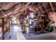 Spacious attic area features wood flooring and ample storage, perfect for organization and keeping belongings safe and dry at 103 Se Tuscawilla Ave, Ocala, FL 34471