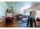 Basement/storage area showcasing hardwood floors and unfinished ceilings at 103 Se Tuscawilla Ave, Ocala, FL 34471