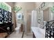 Unique bathroom with a walk-in shower, floral wall art and natural light at 103 Se Tuscawilla Ave, Ocala, FL 34471