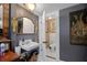 This bathroom features a vintage sink, unique decor, and access to a separate toilet room at 103 Se Tuscawilla Ave, Ocala, FL 34471