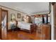Bedroom with hardwood floors, double bed, and vintage decor at 103 Se Tuscawilla Ave, Ocala, FL 34471