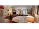Bedroom with hardwood floors, four-poster bed, and vintage decor at 103 Se Tuscawilla Ave, Ocala, FL 34471
