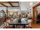 Formal dining room has beautiful ceiling beams, wood accents and view of the living and entry areas at 103 Se Tuscawilla Ave, Ocala, FL 34471