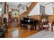 Elegant foyer featuring a grand piano, stained glass window, and beautiful wood staircase at 103 Se Tuscawilla Ave, Ocala, FL 34471