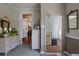 Hallway features wood floors and doors, a decorative mirror, and vintage charm at 103 Se Tuscawilla Ave, Ocala, FL 34471