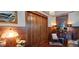 Hallway with classic wood details and vintage decor, illuminated by a chandelier at 103 Se Tuscawilla Ave, Ocala, FL 34471