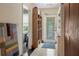 Hallway with decorative doorway, offering charm and style, and tiled floors throughout at 103 Se Tuscawilla Ave, Ocala, FL 34471