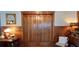 Charming hallway with vintage details, featuring paneled walls and antique accents at 103 Se Tuscawilla Ave, Ocala, FL 34471